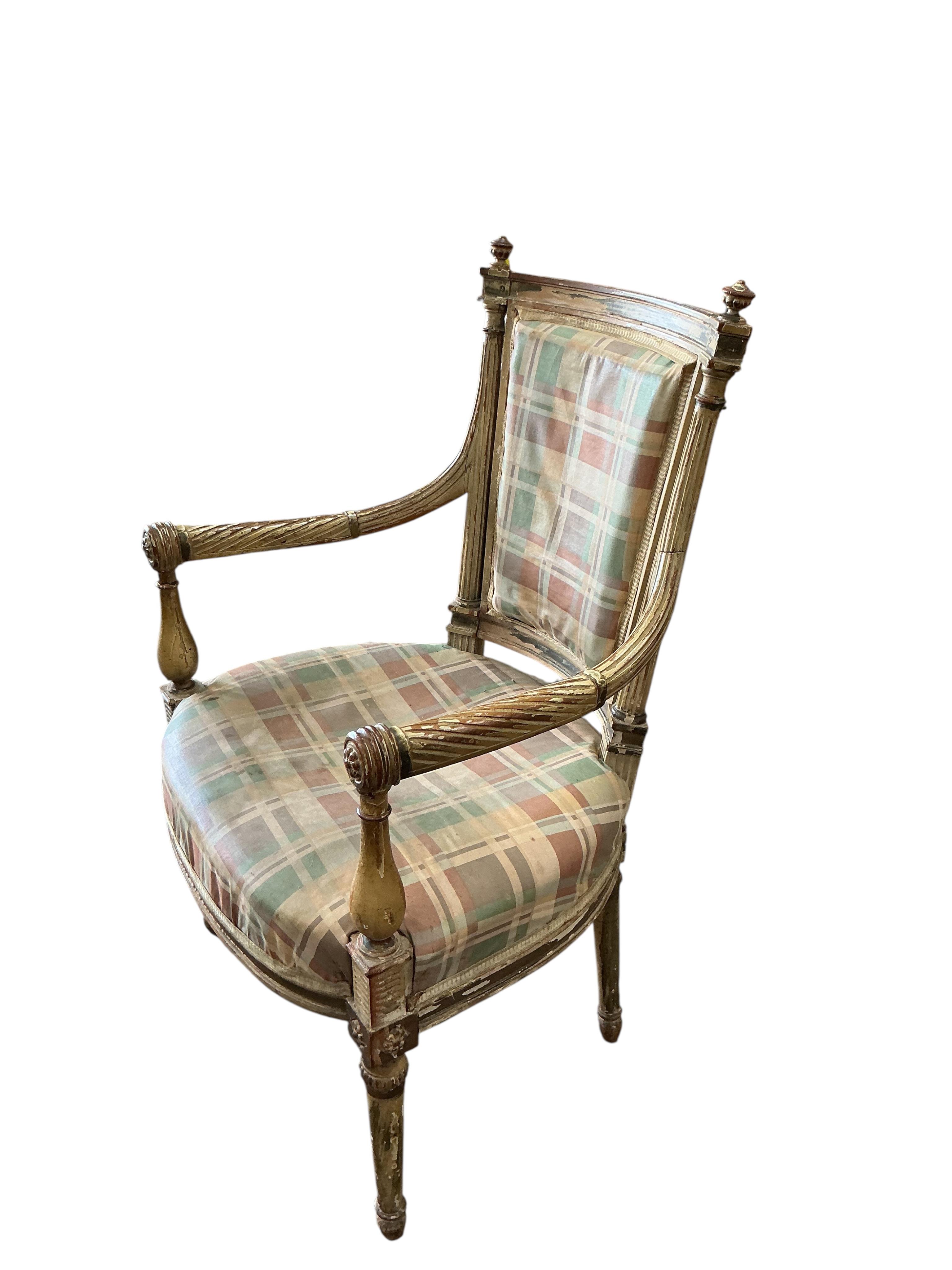 A Louis XVI style cream painted and parcel gilt open armchair, width 55cm, depth 60cm, height 90cm